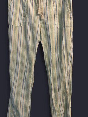Striped linen pants with drawstring waist and pockets.